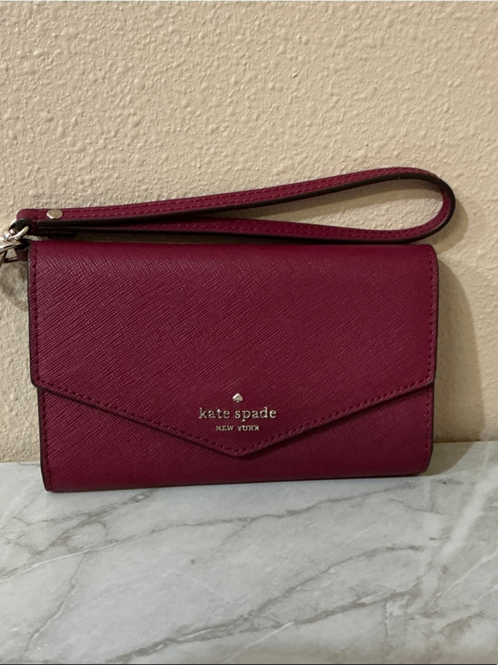 kate spade Plum Saffiano Leather Wristlet/Wallet with Gold Logo. NWOTs